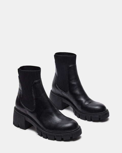 Faux fur ankle boots Louis Vuitton Black size 38 EU in Faux fur